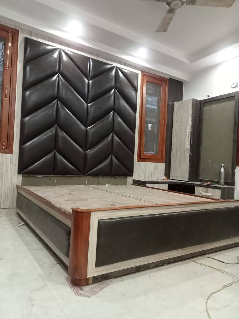 Final finishing touches on custom wood furniture in Majid's Delhi workshop