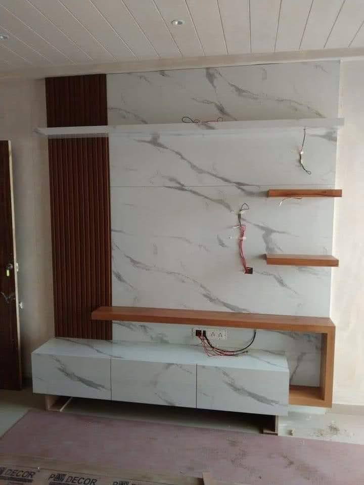 Final finishing touches on custom tv unit in Majid's Delhi workshop